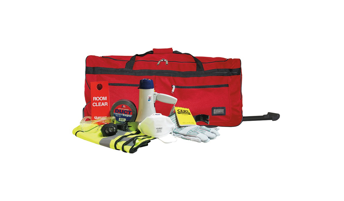 A medical bag with its contents of medical and evacuation supplies spread out.