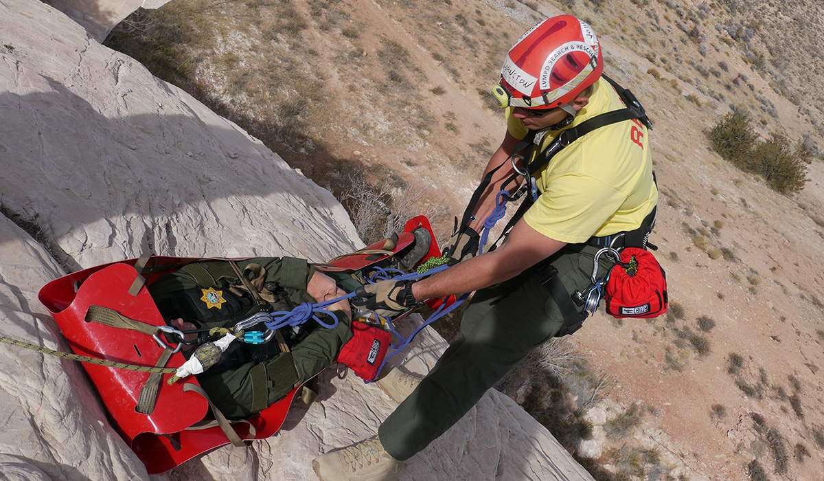 Evacuee strapped into a sled lifted to safety.
